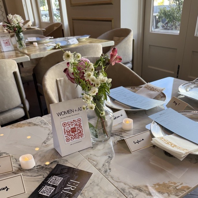 Women + AI event table setting